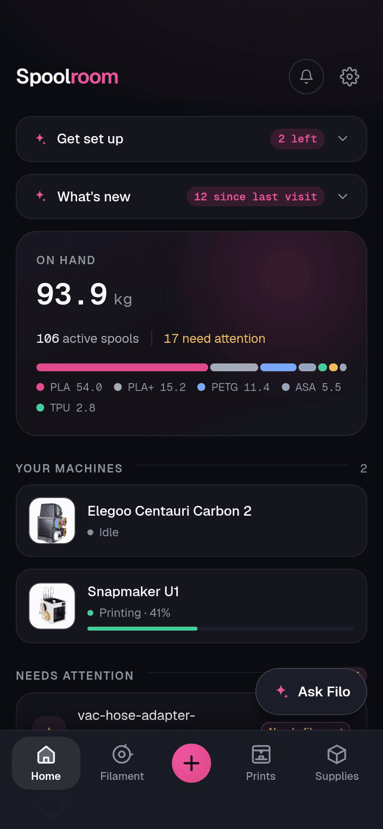 The Spoolroom dashboard on a phone: total filament on hand, spools that need attention, and the tab bar with the Ask Filo button floating above it.